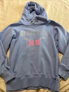 Blue 84 Light Blue Hoodie with Pink "MN" Graphic